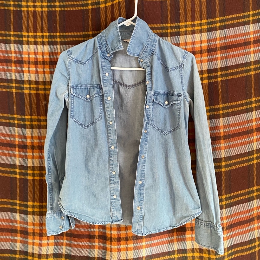 Light blue denim, collared button-up shirt